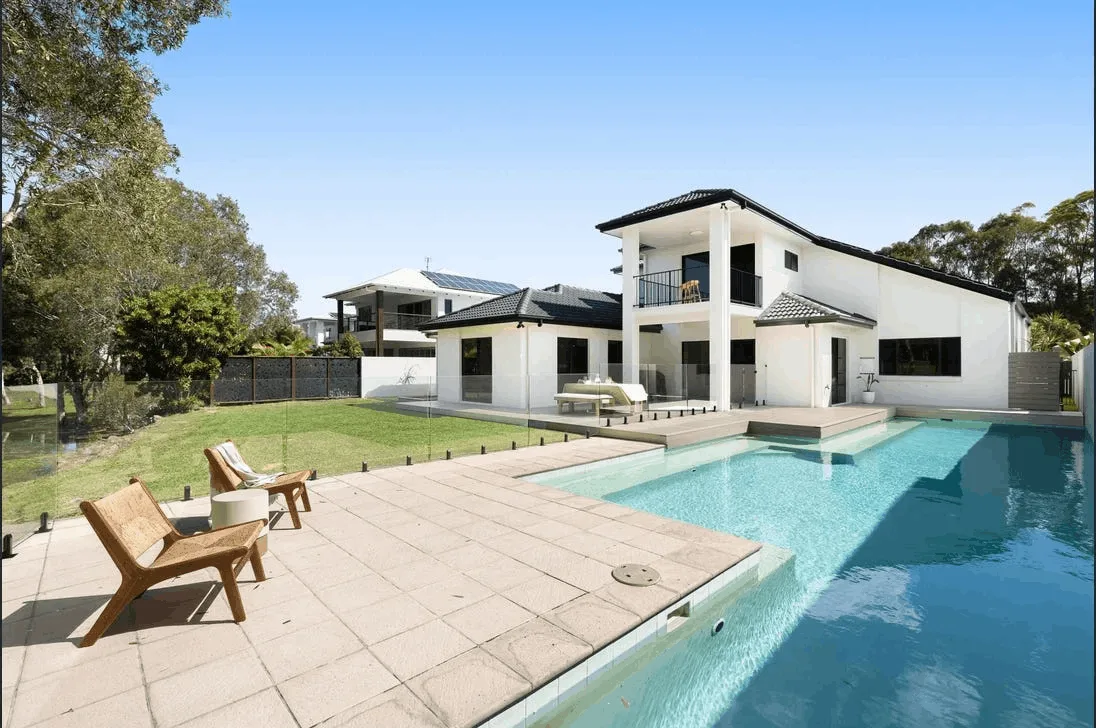 Frameless glass pool fencing beside a modern Brisbane southside home